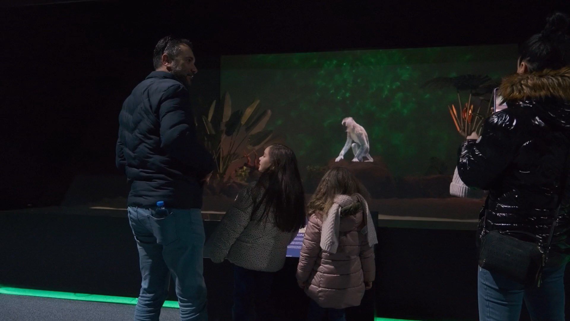 Family experiencing holographic wildlife